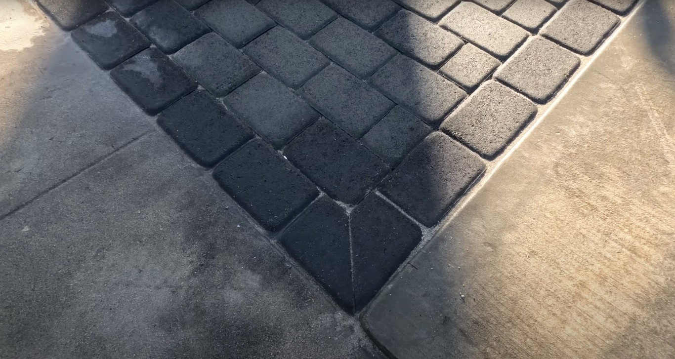 Decorative stamped concrete with herringbone pattern